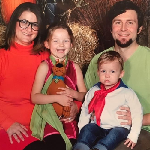 Sierra with her husband and kids dressed up for Halloween