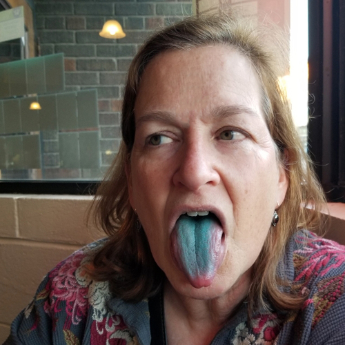 Tracy Noyes stick out blue tongue