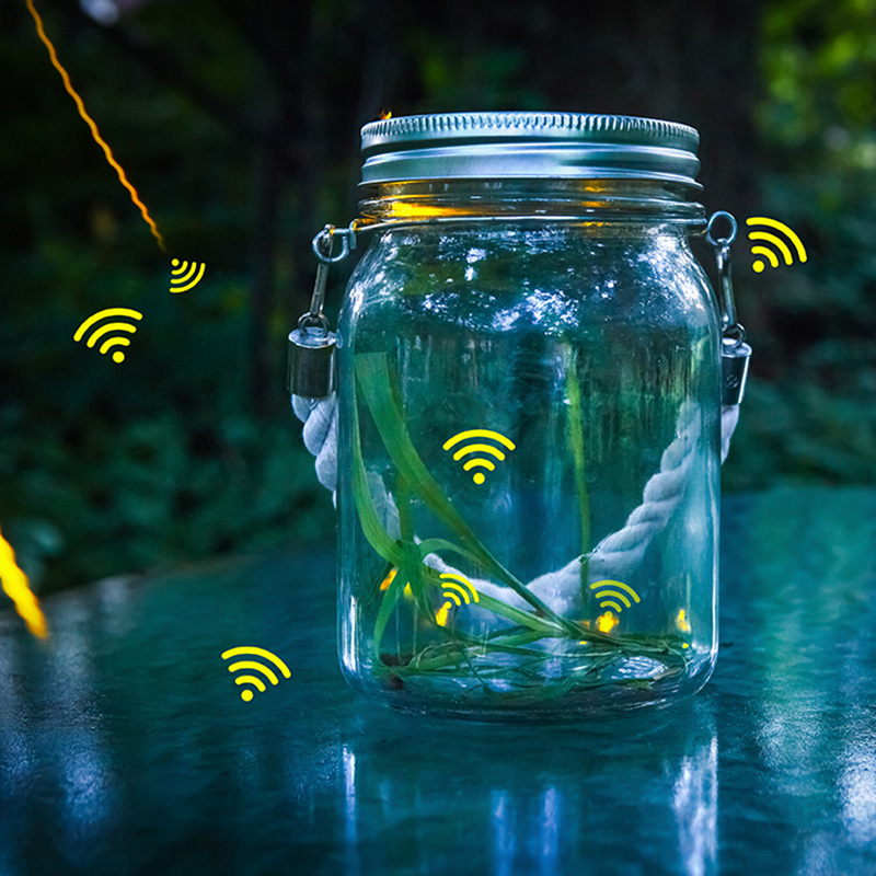 a photo for Astrea of a jar on a table used to capture flying WiFi symbols as if they were lightning bugs 