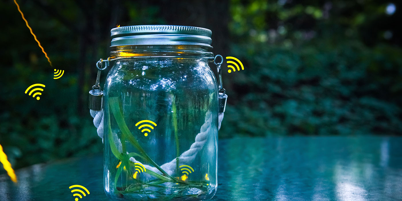 glass jar outside with bright-colored wifi icons positioned as lightning bugs